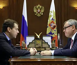 MEETING: Russia's President Medvedev is briefed on the concept of mobile contactless payments by Andrei Kostin, head of the country's largest bank