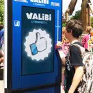 Theme park visitors 'like' rides on Facebook by touching a contactless bracelet to a Walibi 'Totem'