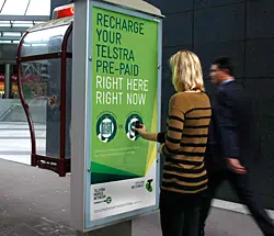 Telstra's NFC phone booth ad campaign in action