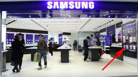 The pop-up poster sits at the front of the Samsung store