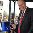 CEO Sureyya Ciliv boards a bus with Turkcell Wallet