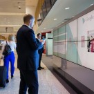 A traveller interacts with a Google NFC ad at Sydney airport