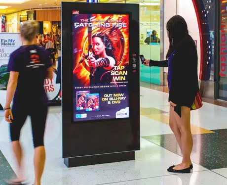 Interactive NFC DOOH panel advertising The Hunger Games Catching Fire