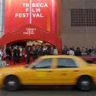 Yellow cab passing Tribeca Film Festival venue