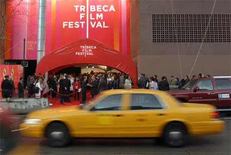 Yellow cab passing Tribeca Film Festival venue