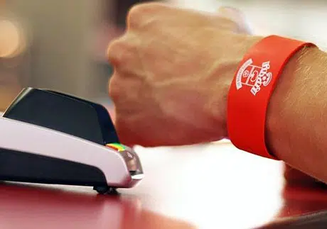 A Saints bPay wristband in use