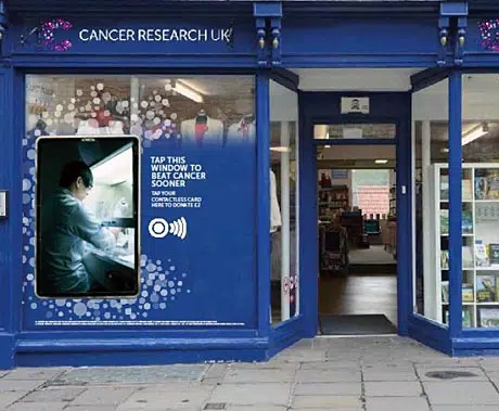 Cancer Research UK contactless donation window display