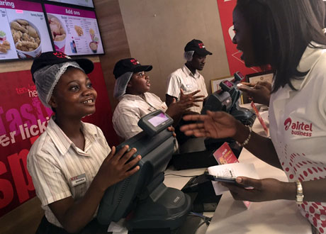 Mobile payments being made for meals at a KFC fast-food outlet in Accra, Ghana