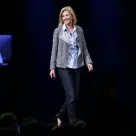 Apple's vice president of internet services, Jennifer Bailey, takes the stage