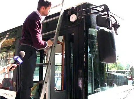 Onyx Beacon's CTO installs a Bluetooth beacon on a Bucharest trolleybus