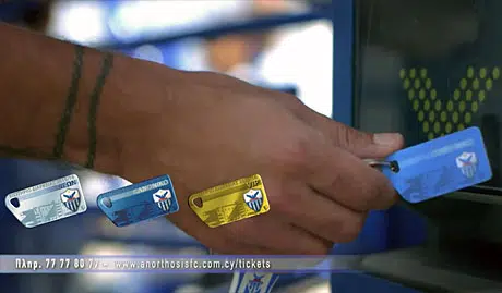 A season-ticket holder presents an NFC keycard for entry to the ground