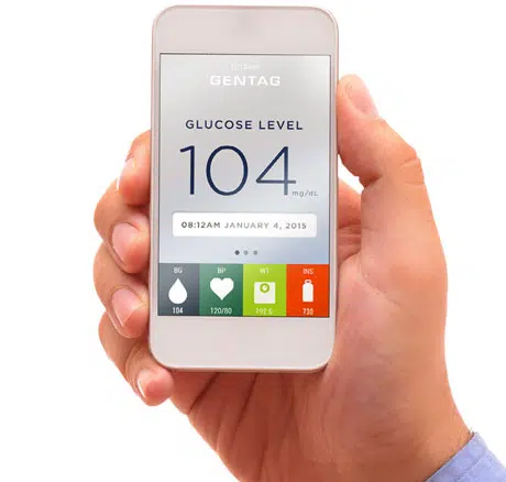 A phone shows a patient's glucose level