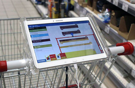 A tablet mounted on the shopping cart guides shoppers around the store
