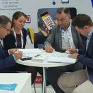 Valitor and Dejamobile representatives ink their agreement at Money20/20 Europe