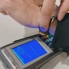 The wearer authorises contactless payments with a fingerprint scan