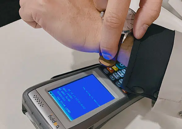 The wearer authorises contactless payments with a fingerprint scan