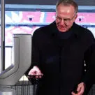 Two-time European Footballer of the Year and now Bayern Munich CEO Karl-Heinz Rummenigge tries out the NFC access gates at the Allianz Arena