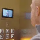 Man looking at lift screen