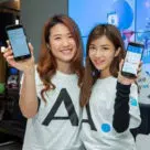 Two women holding smartphones