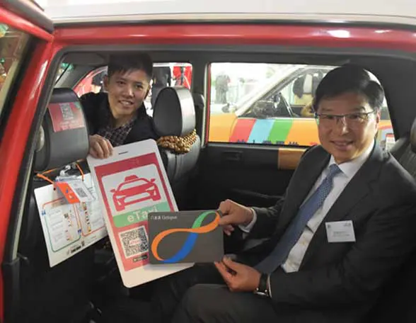 2 men sitting in a taxi