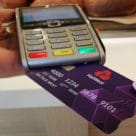 Debit card being put into card reader
