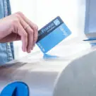 Hand holding travel card