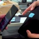 Smartphone being tapped on NFC tag on clothing
