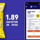 Bag of Lay's crisps and a smartphone with code printed over top