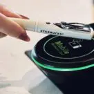 NFC pen being tapped on payment terminal