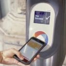 NFC smartphone beiing tapped on reader terminal