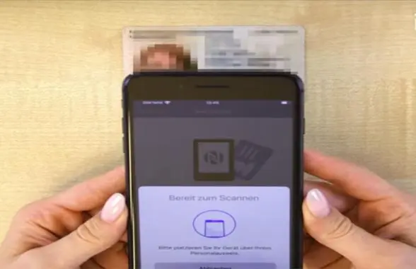 NFC smartphone screen with national ID card in background