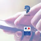 Hand holding smartphone with Alicem and French Ministry of Interior logos over the top