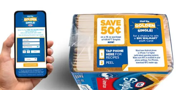 Hand holding smartphone next to pack of Kraft Single cheese