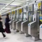 Blurred image of people entering nfc ticket barriers