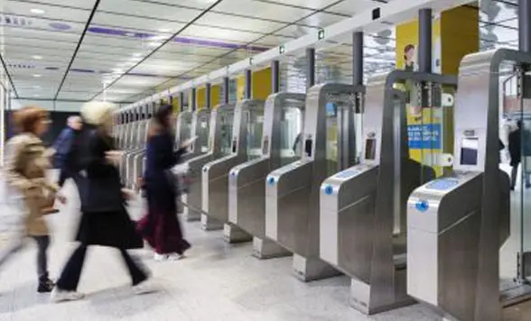 Blurred image of people entering nfc ticket barriers