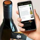 Vigneti massa wine bottle with Guala Nestgate NFC bottle top and NFC phone