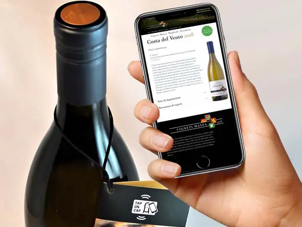 Vigneti massa wine bottle with Guala Nestgate NFC bottle top and NFC phone