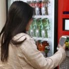 Student uses Apple iPhone NFC ID to buy from vending machine