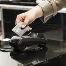 Norway BankAxept contactless payment card being tapped on terminal