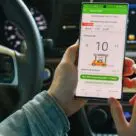 Person using 7-Eleven voice command mobile payment app