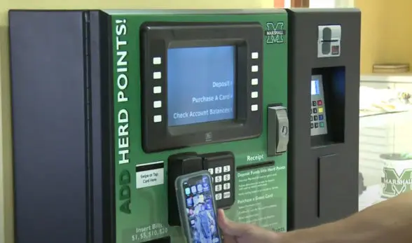 Marshall University student using their NFC mobile ID on campus