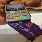 NatWest debit card being put into a card reader