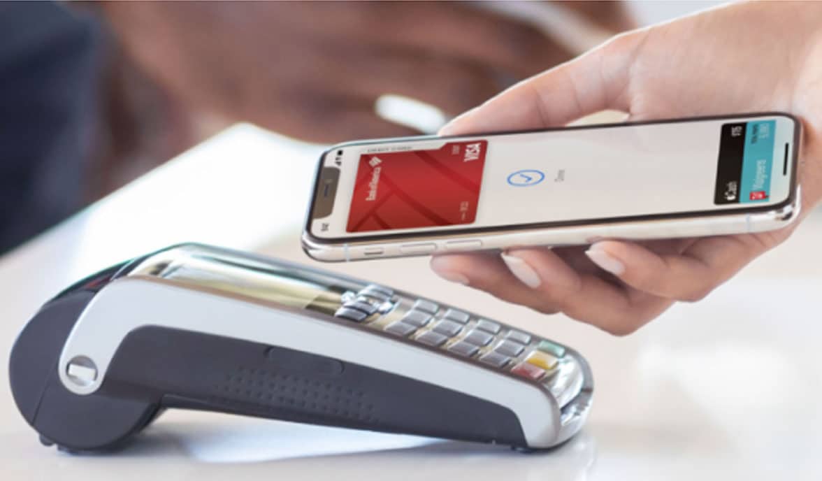 iPhone being used to make Apple Pay contactless NFC payment