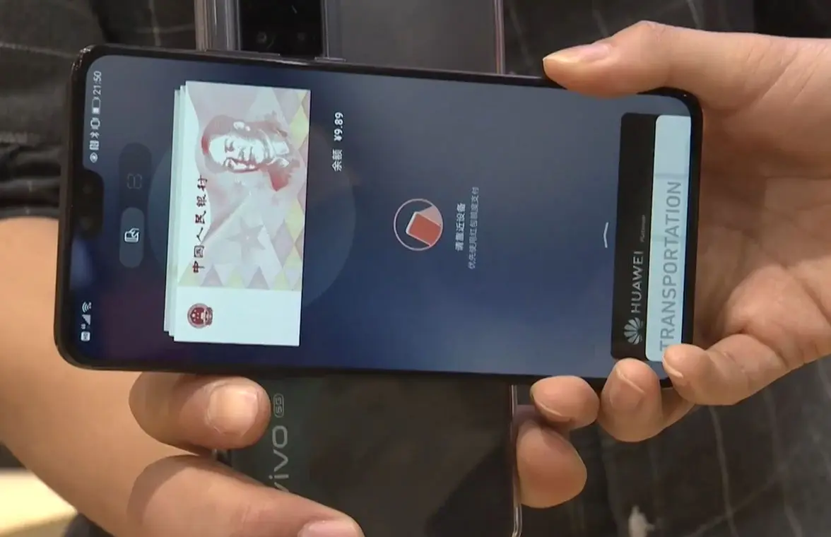 NFC phones being used to pay using digital yuan