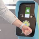 Wearable being used to make a contactless payment on Metrolinx Toronto