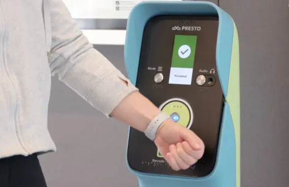 Wearable being used to make a contactless payment on Metrolinx Toronto