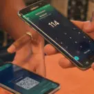 Shoppers using East Caribbean Central Bank digital currency on their smartphones