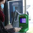 Customer using Brescia Mobilità contactless ticket validator