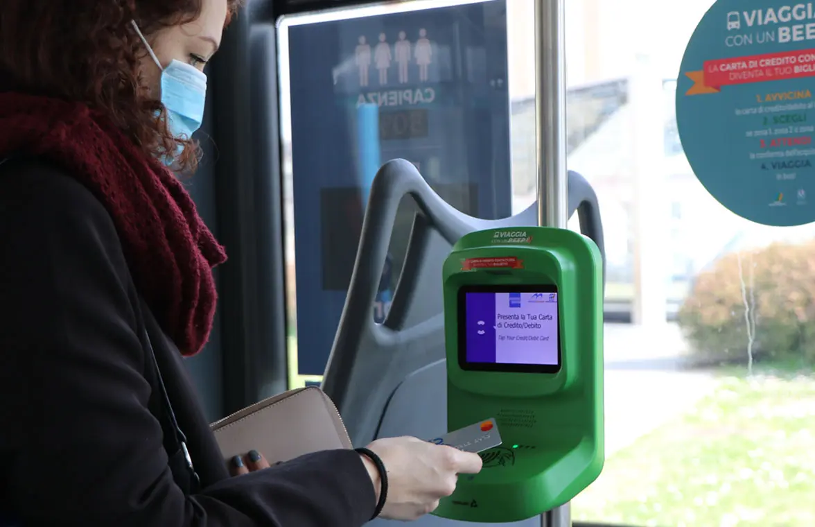 Customer using Brescia Mobilità contactless ticket validator