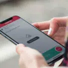 Fairtiq check in check out’ app-based fare payment system on a smartphone